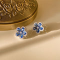 Orecchini a fiori color blu zircone Cn365