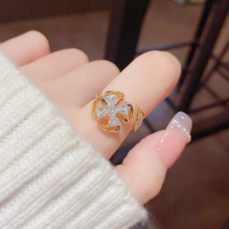Micro Inlaid Zircon Rotatable Four-Leaf Flower Ring Cn0308