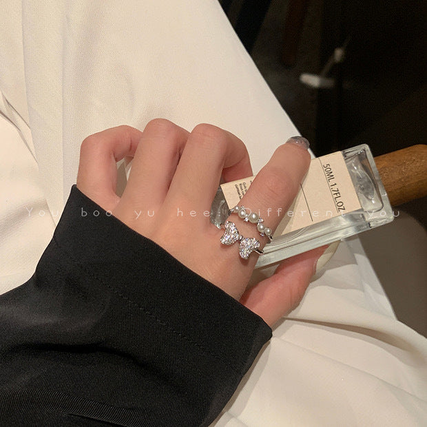 Nhẫn đôi nơ zircon khảm siêu nhỏ