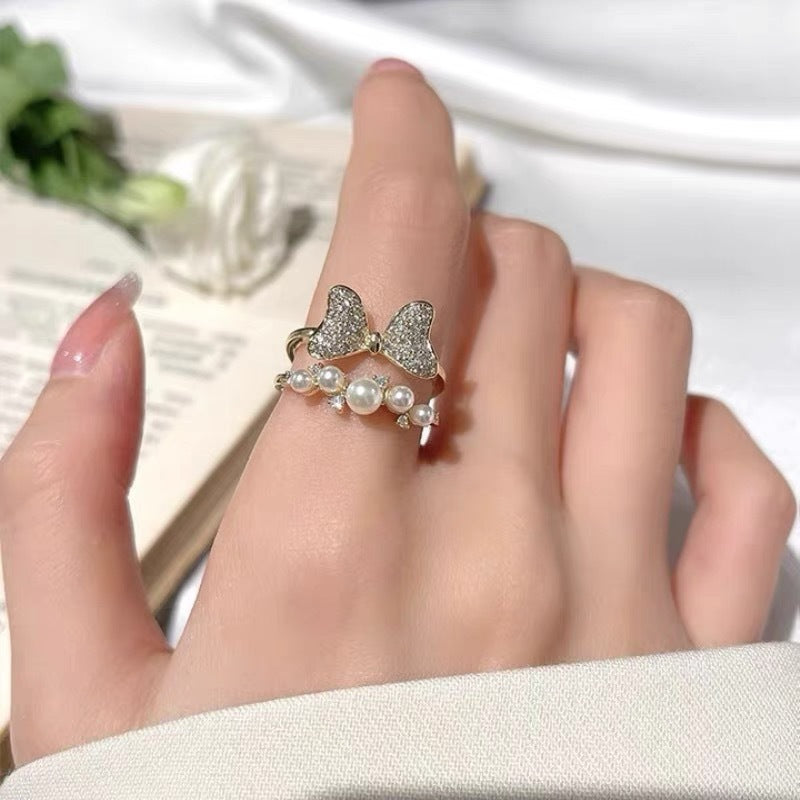 Nhẫn đôi nơ zircon khảm siêu nhỏ