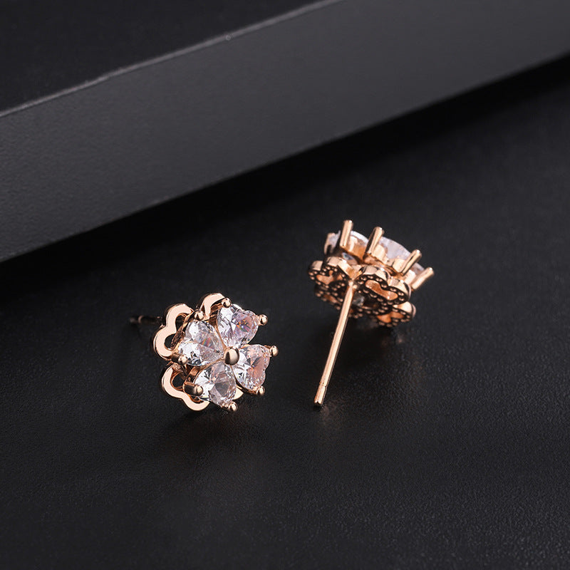 Sterling silver four-leaf clover revolving zircon earrings