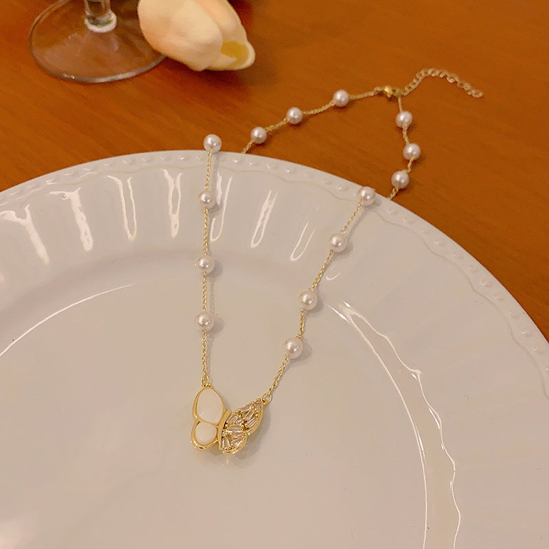 Long fringed butterfly imitation pearl necklace