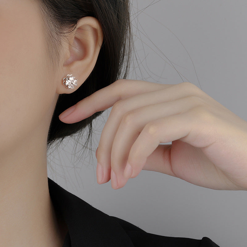 Sterling silver four-leaf clover revolving zircon earrings