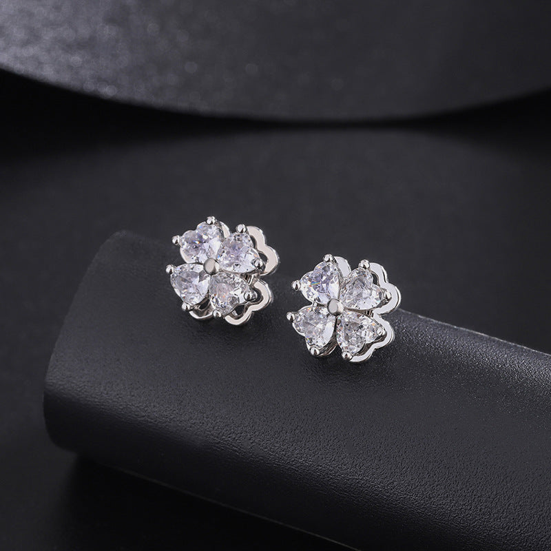 Sterling silver four-leaf clover revolving zircon earrings