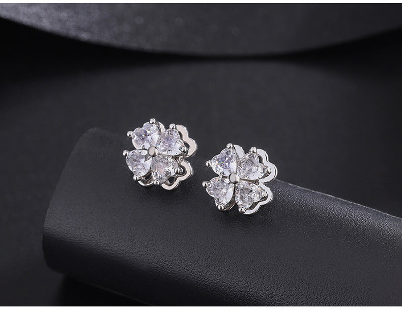 Sterling silver four-leaf clover revolving zircon earrings