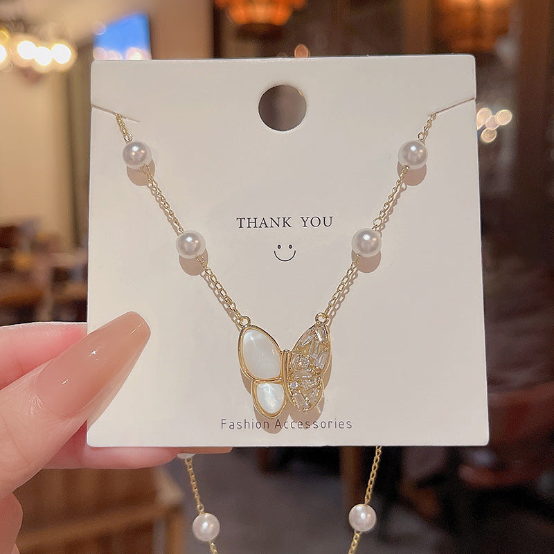 Long fringed butterfly imitation pearl necklace