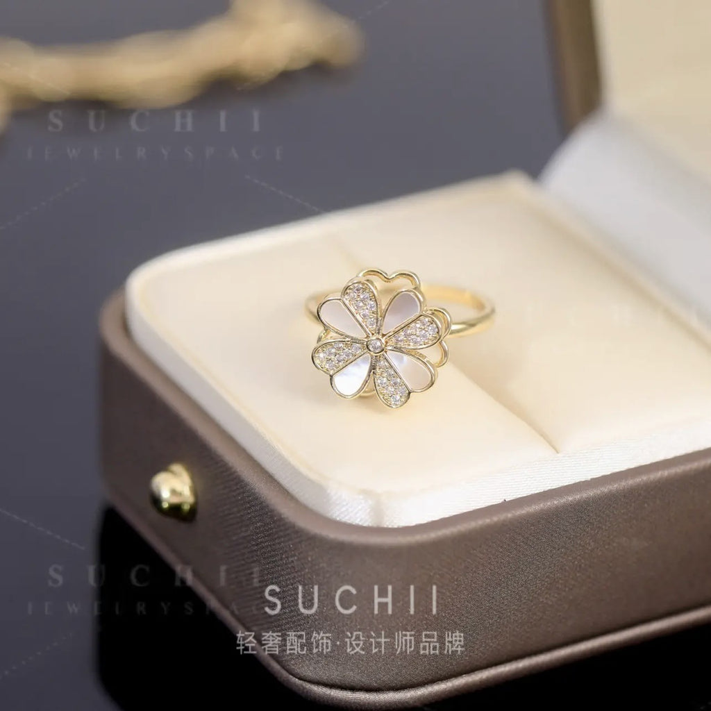 Rotatable four-leaf clover shell color matching ring