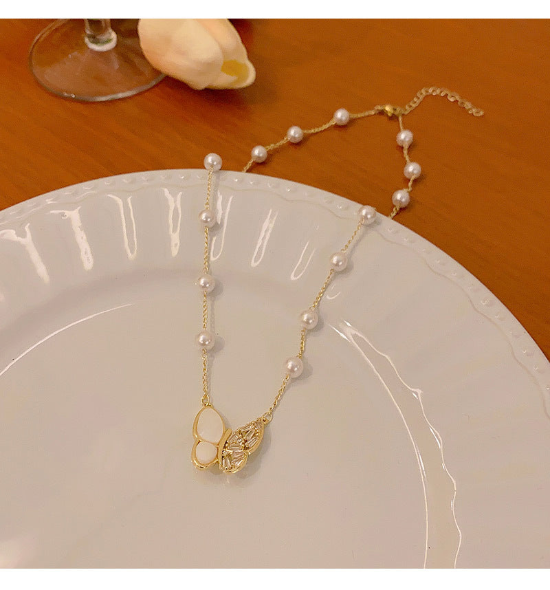 Long fringed butterfly imitation pearl necklace